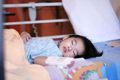 Patient sleeping on bed in hospital