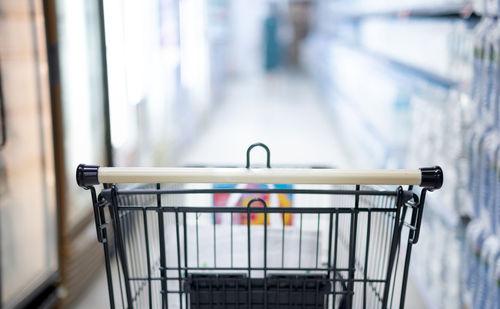 Close-up of empty trolley in store