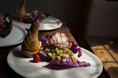 Pear in plate on table at home