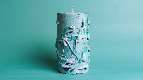 Close-up of blue paint on table