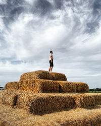 Full length of man standing on field against sky