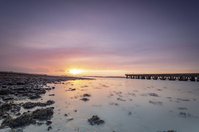 Scenic view of sea against sky during sunset