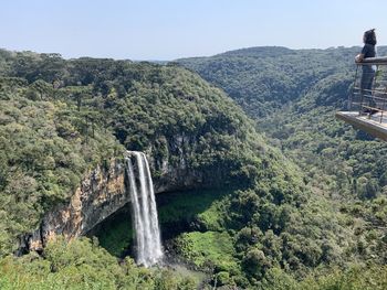 Scenic view of waterfall against sky