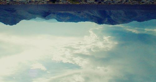 Scenic view of mountains against cloudy sky