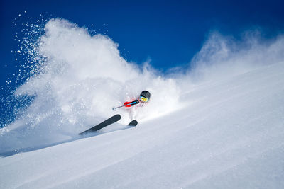 Person with umbrella on snow