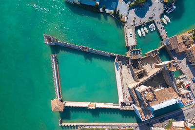 Aerial view of houses by sea in town