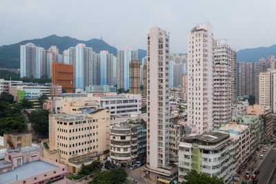 High angle view of buildings in city against sky