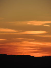 Scenic view of dramatic sky during sunset