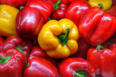 Full frame shot of red bell peppers for sale in market