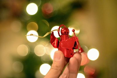 Close-up of christmas decoration in woman's hand