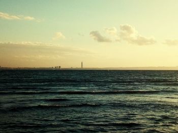 Scenic view of sea against sky at sunset