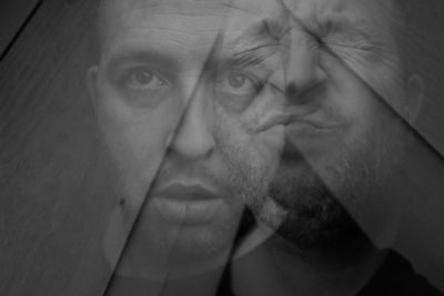Double exposure of man with facial expression