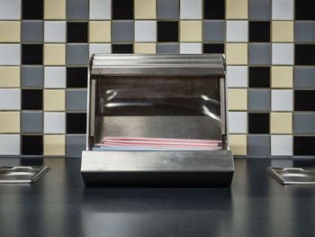 Close-up of drinking straw dispenser in fast food restaurant