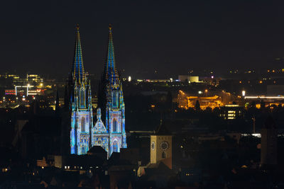 Illuminated buildings in city at night