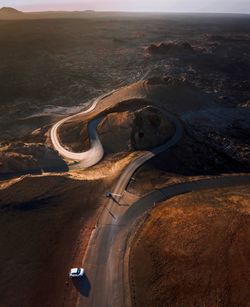 Aerial view of winding road amidst landscape