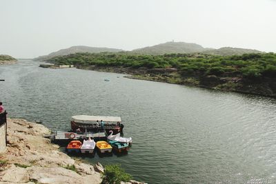 High angle view of boats in sea against clear sky