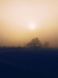 Scenic view of landscape at sunset