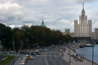 View of city street and buildings against sky
