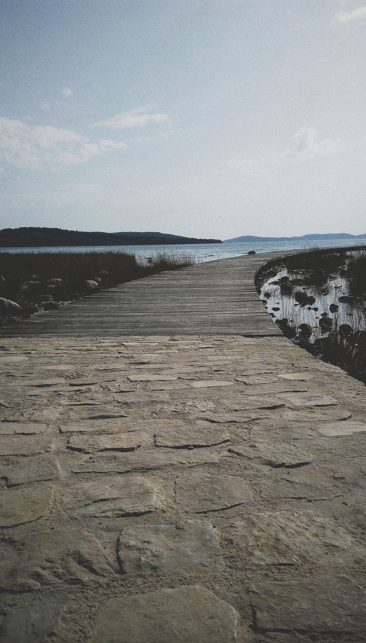 sky, water, sea, tranquility, scenics - nature, beach, beauty in nature, tranquil scene, nature, land, no people, cloud - sky, horizon, day, non-urban scene, outdoors, rock, horizon over water, remote