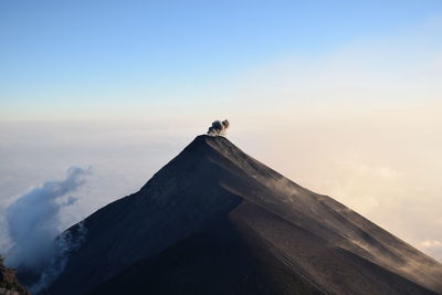 View of a bird on mountain against sky