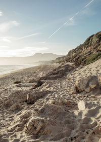 Scenic view of beach against sky