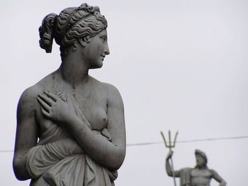 Low angle view of statue against sky
