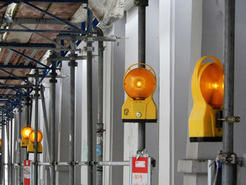 Yellow lanterns hanging in factory