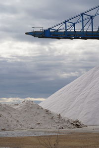 View of salt over land against sky