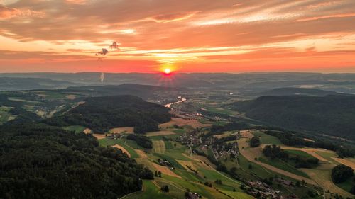 Scenic view of landscape against sky during sunset