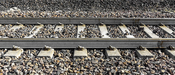 High angle view of pigeons on railroad track