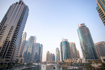 Low angle view of buildings in city against sky