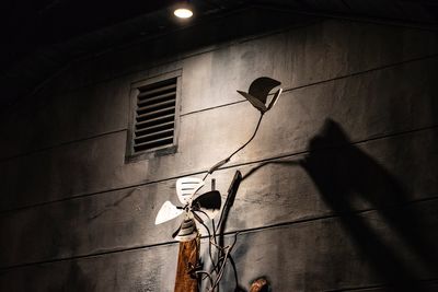 Low angle view of street light against building