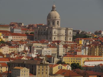 High angle view of buildings in city against clear sky