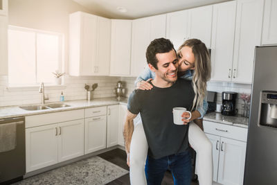 Portrait of happy friends at home