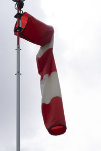 Low angle view of flag against sky