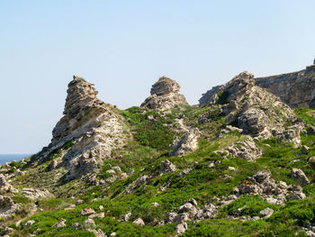 Scenic view of rocky mountains against clear sky