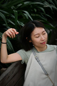 Portrait of young woman looking away