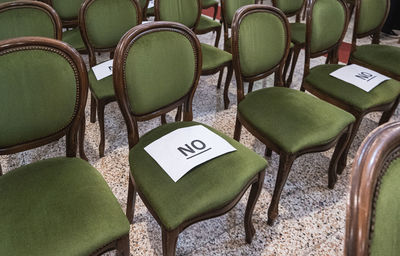 High angle view of empty chairs and table