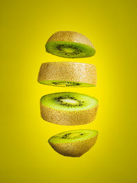 Close-up of bananas against yellow background