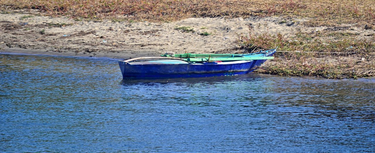 BOAT MOORED ON LAKE