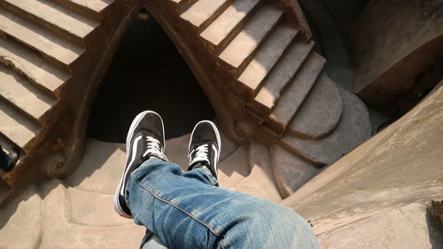 Low section of man relaxing on floor