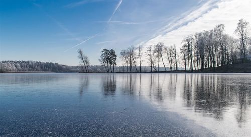 Scenic view of lake against blue sky