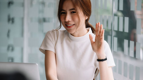 Portrait of young woman using mobile phone