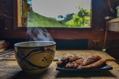 Close-up of tea and food on table