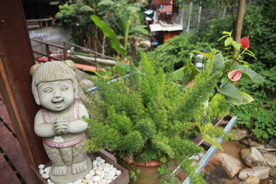 Buddha statue amidst plants