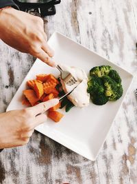 Midsection of person preparing food on table