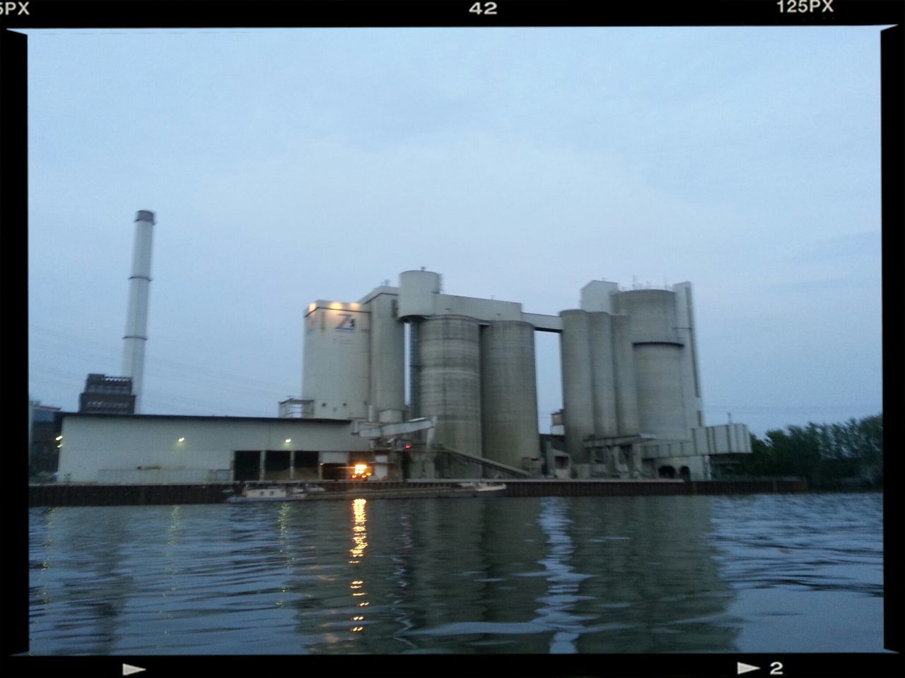 transfer print, architecture, built structure, water, building exterior, auto post production filter, waterfront, reflection, sky, city, river, sea, tower, outdoors, no people, clear sky, skyscraper, industry, building, day