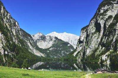 Scenic view of mountains against clear blue sky