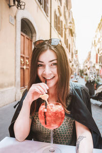 Young woman drinking glass