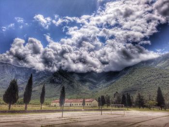 Scenic view of mountains against cloudy sky